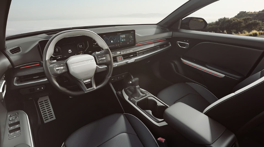 High-tech interior dashboard of the 2026 Kia K4 GT-Line showing driver-focused digital instrument cluster, widescreen infotainment system, leather seats, and red ambient trim lighting, in stock at Classic Kia serving Waukegan and Lake County