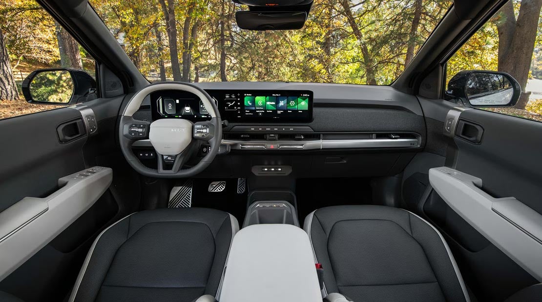 Spacious front seating and center console of the 2027 Kia EV3 at Classic Kia Waukegan